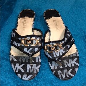 Black and gold Michael Kors sandals.